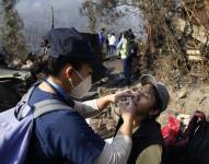 Asistencia médica ante incendios forestales en Quito el 25 de septiembre de 2024. (Photo by Galo Paguay / AFP)