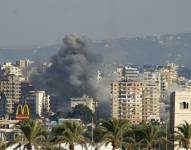 Smoke billows after an Israeli strike on villages near the southern Lebanese city of Tyre on September 29, 2024. (Photo by Kawnat HAJU / AFP)