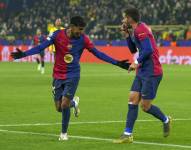 Ferran Torres celebra uno de sus goles del Barcelona en campo del Borussia Dortmund.