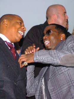 Fame Pictures 310 276 9202 Jay Z talks to an animated Diddy at the grand opening of the 40/40 Club in Atlantic city. 10/26/05